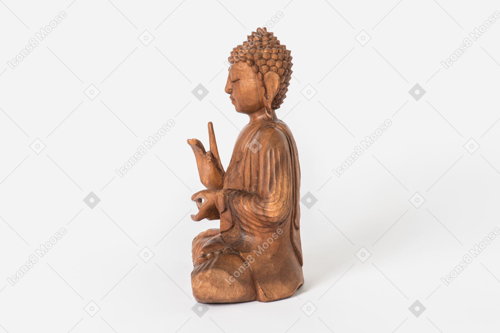 Buddha statue placed in profile on white background
