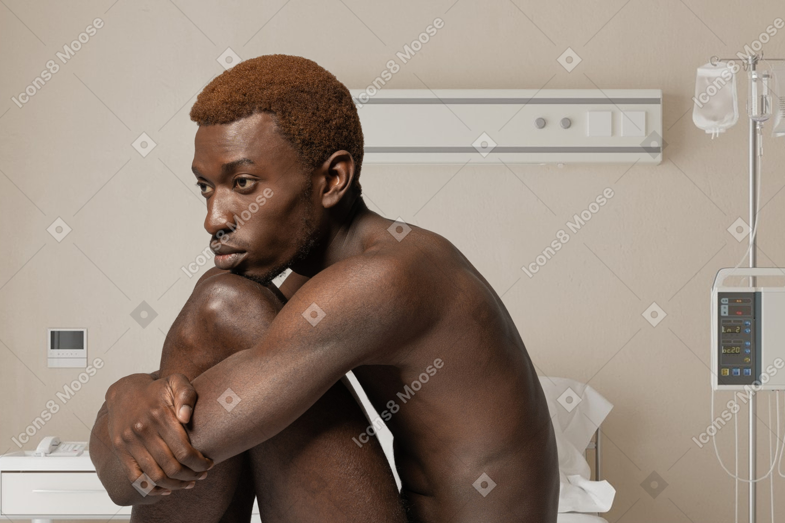 Young man sitting in a hospital room
