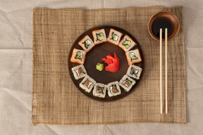 A set of sushi rolls on a platter