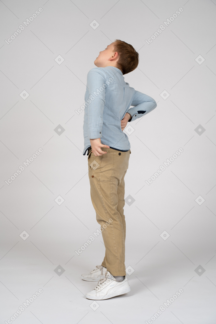 Side view of a boy stretching