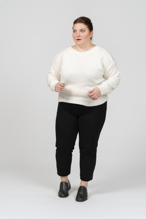 Surprised plus size woman in casual clothes