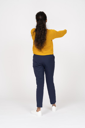 Back view of a girl in casual clothes showing thumb down