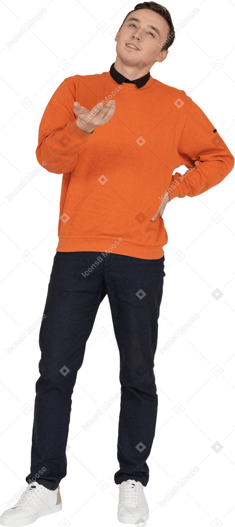 Young man in orange sweatshirt standing