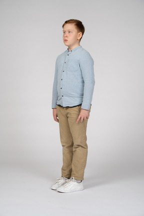 Boy standing with neutral face