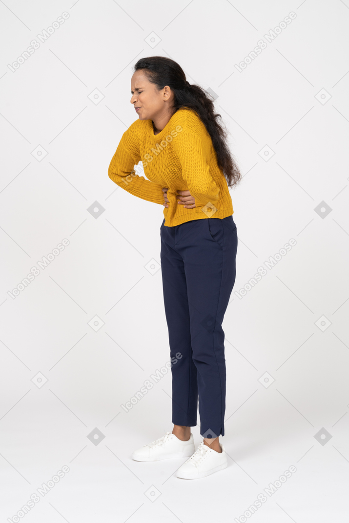 Girl in casual clothes suffering from stomachache