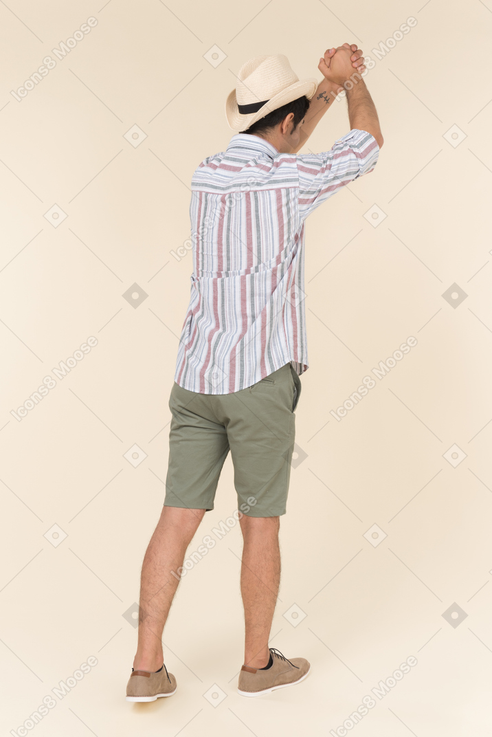 Young guy doing a salutation gesture