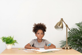 Good looking cute girl with books at the table