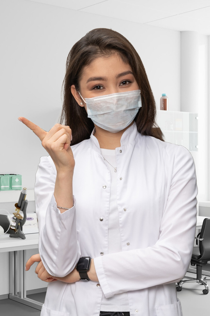 Portrait of a female dentist with dental tools