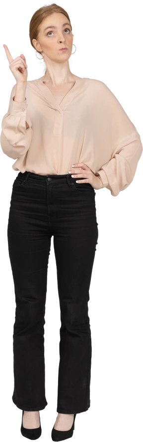 Woman in beautiful blouse standing