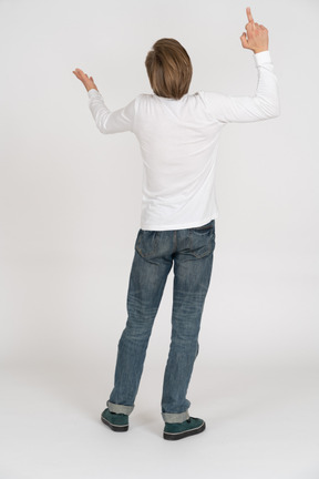 Young man in casual clothes standing