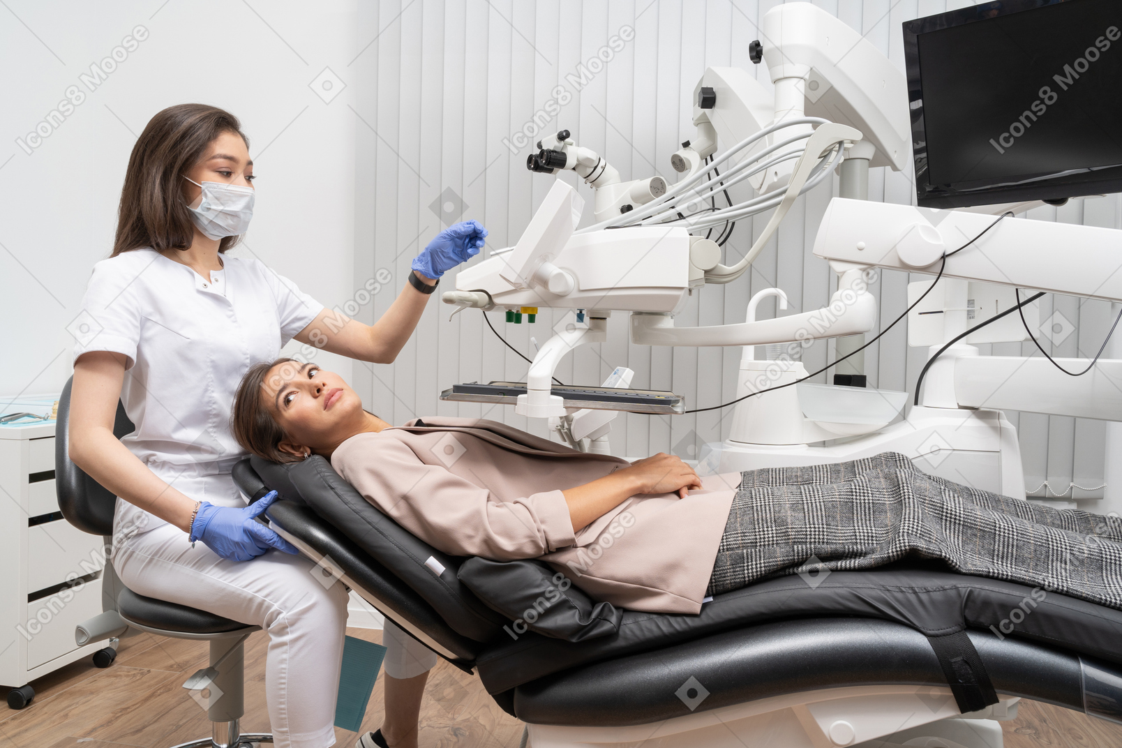 Full-length of a female dentist finishing dental examining of her female patient
