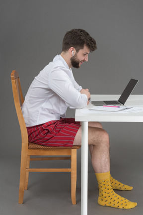 Manager having a conference call in his home office