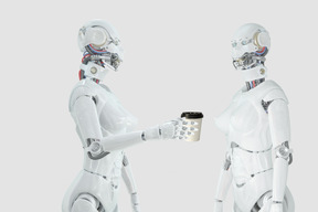 A robot holding a cup of coffee talking to another robot