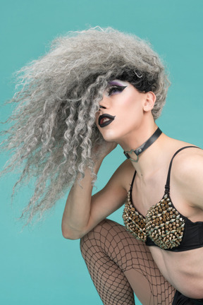 Close-up of a drag queen posing with messy hair