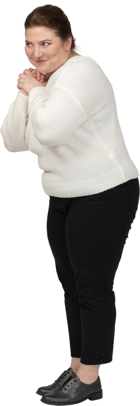 Side view of a happy plump woman in casual clothes