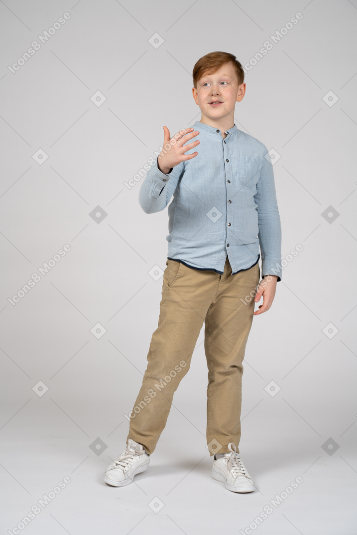 Front view of a boy explaining something