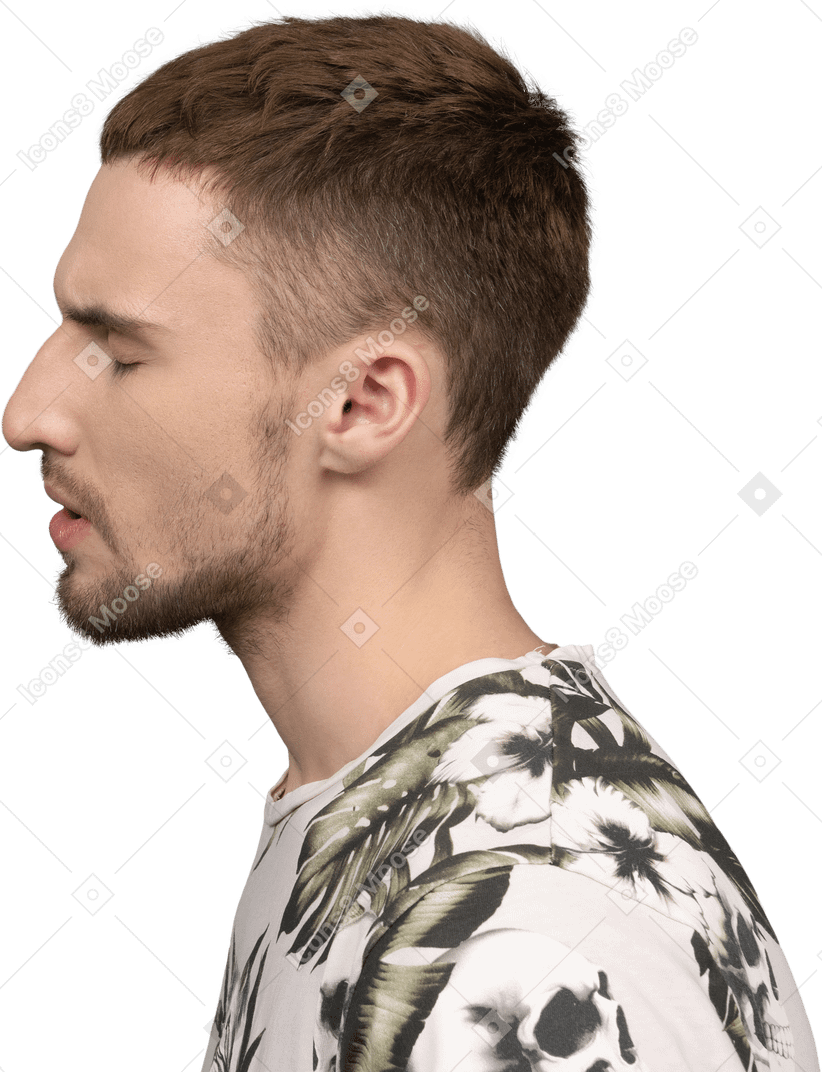 Young caucasian man standing with closed eyes looking tired as if having headache