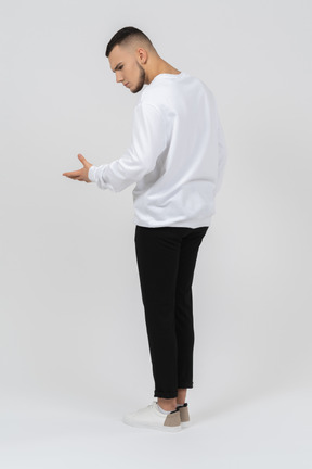 Back view of a solemn man in casual clothes