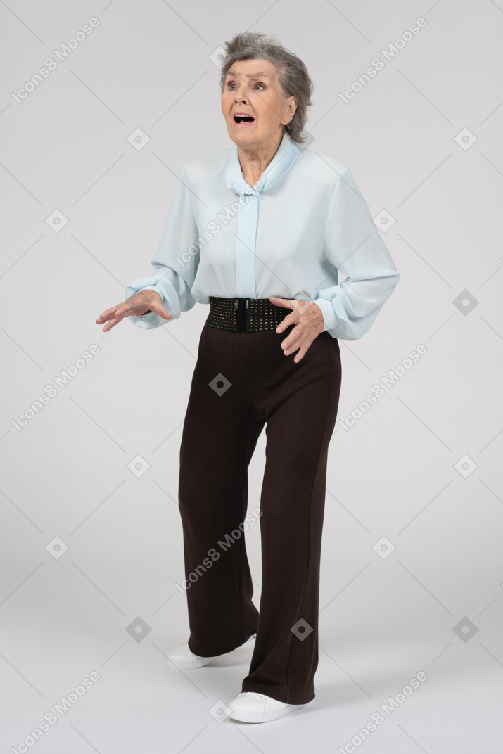 Three-quarter view of an old woman looking lost and panicked