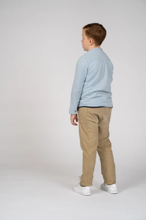 Boy standing back to camera