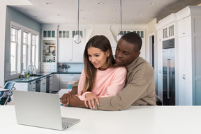 Attractive couple watching some show online together