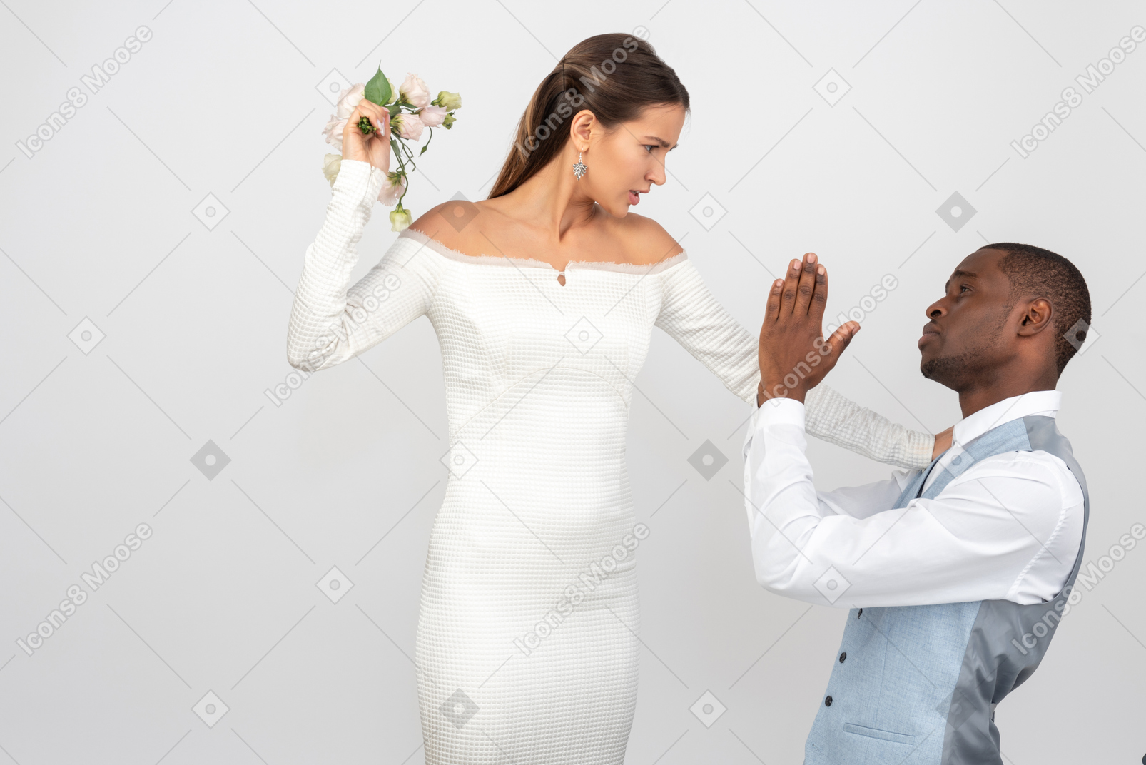 Bride is going to punch groom with the wedding bouquet
