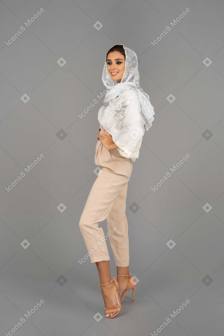 Portrair of a smiling confident young woman wearing white headscarf