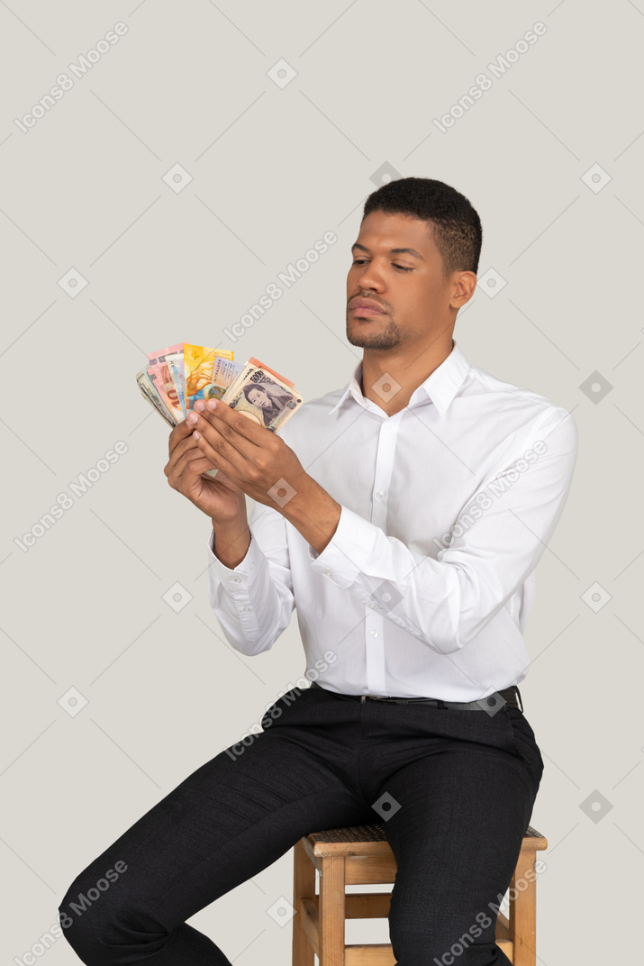 Man holding a stack of money