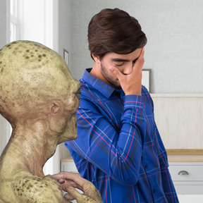 Alien communicating with a man doing facepalm