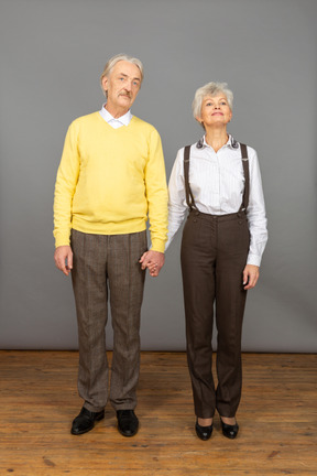 Middle-aged couple holding hands