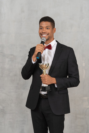 Man in suit accepting an award