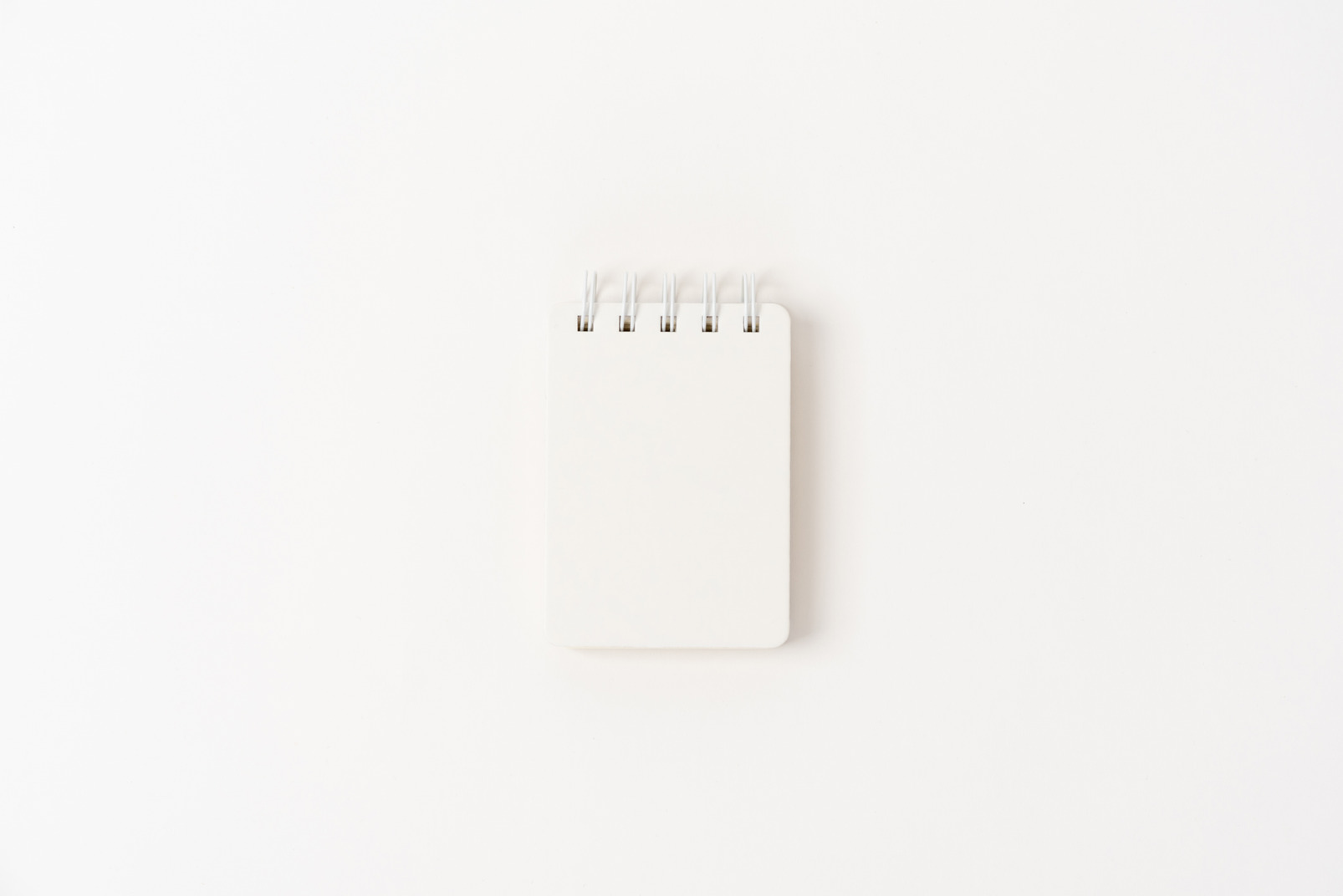 White notebook on white background