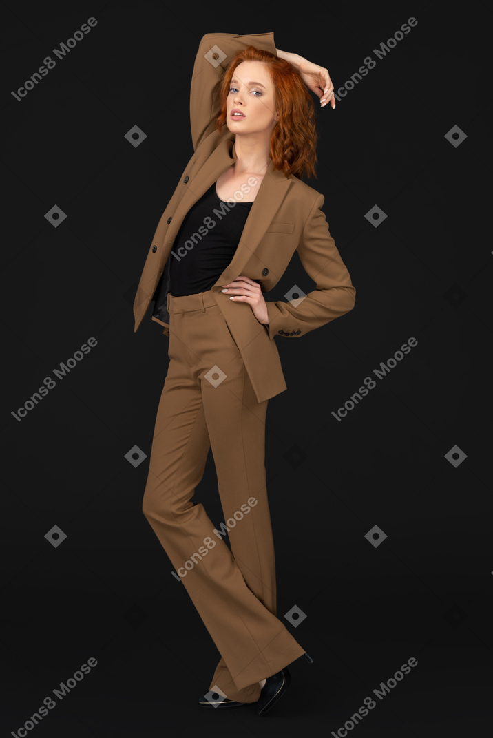 Woman with hand on hip posing for camera