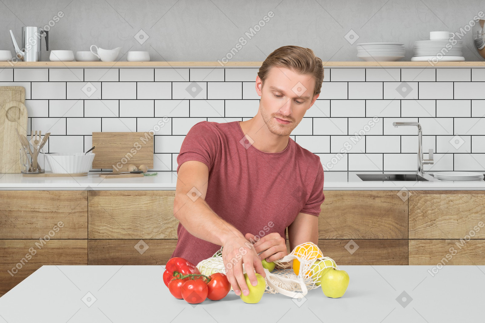 A man in a kitchen taking vegetables out of reusable bag