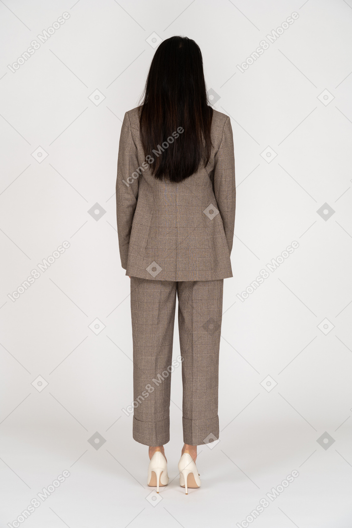 Back view of a young lady in brown business suit