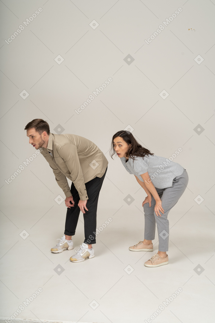 Young man and woman trying to catch breath