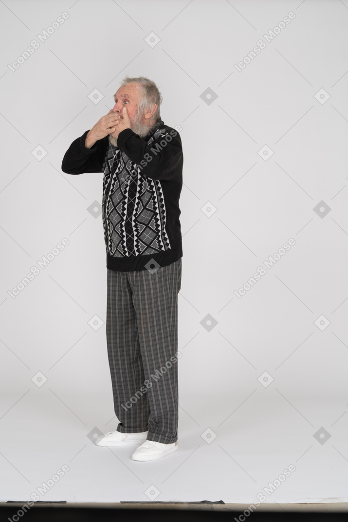 Old man covering mouth
