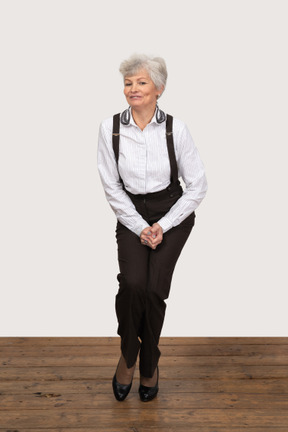 Awkward businesswoman standing with legs pressed together