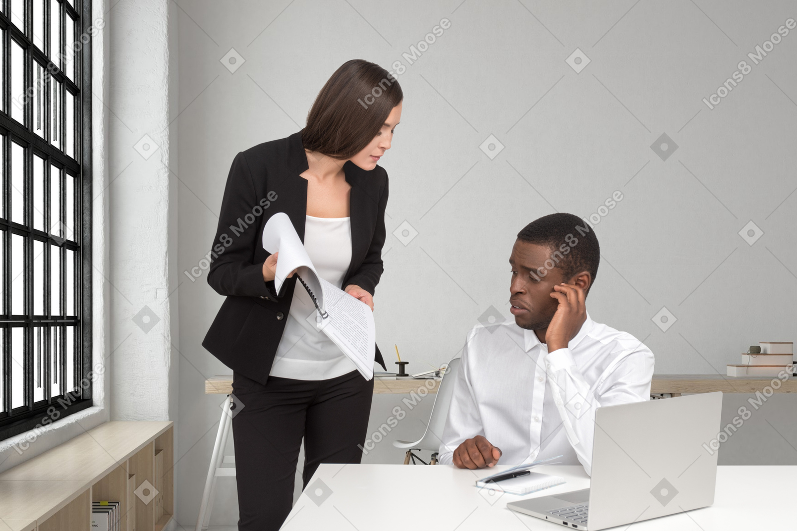 Female boss asking puzzled employee about report