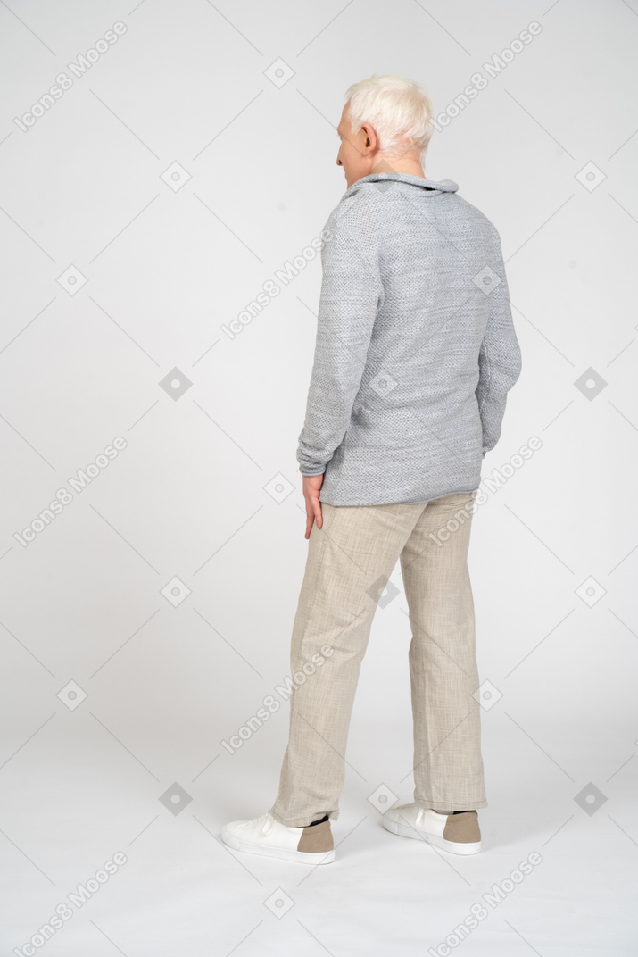Man standing with his back facing the camera