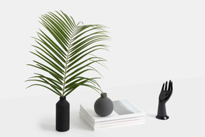 Black vase with palm branch