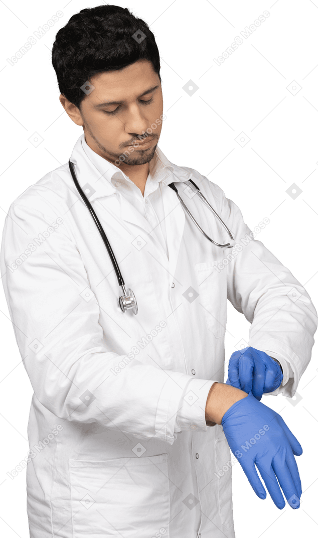 Doctor taking off his gloves