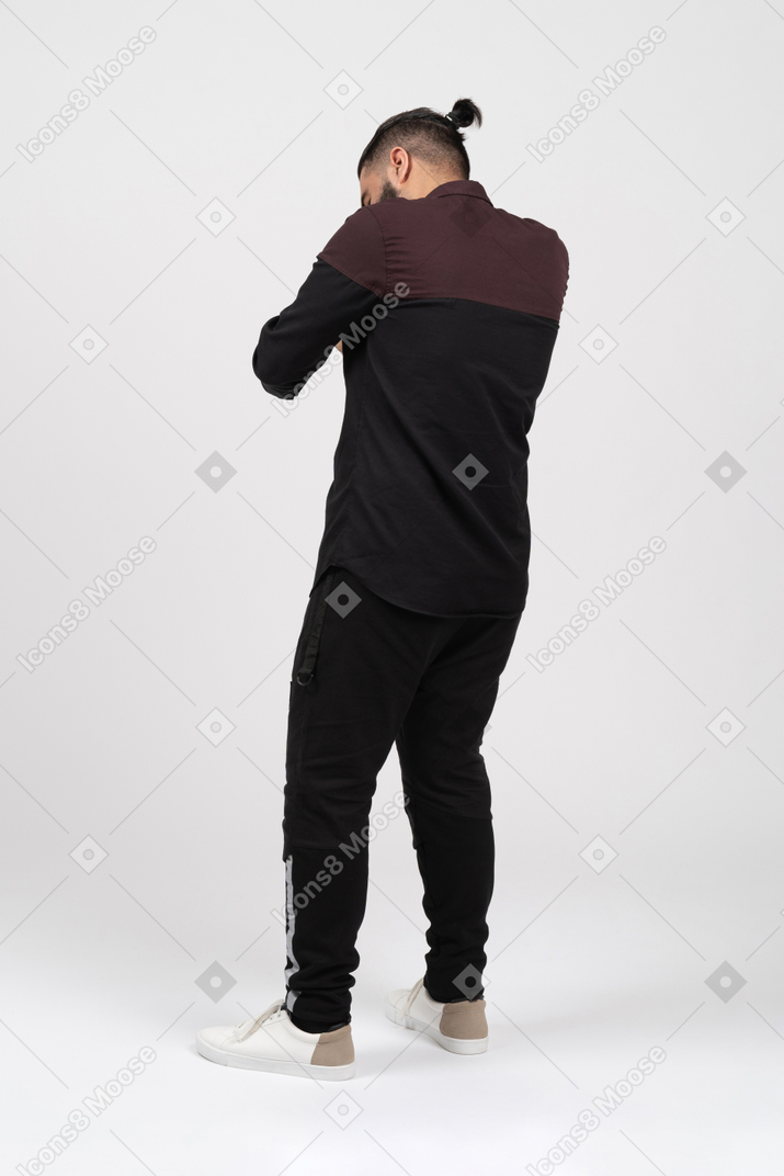 A man hiding face in his hands