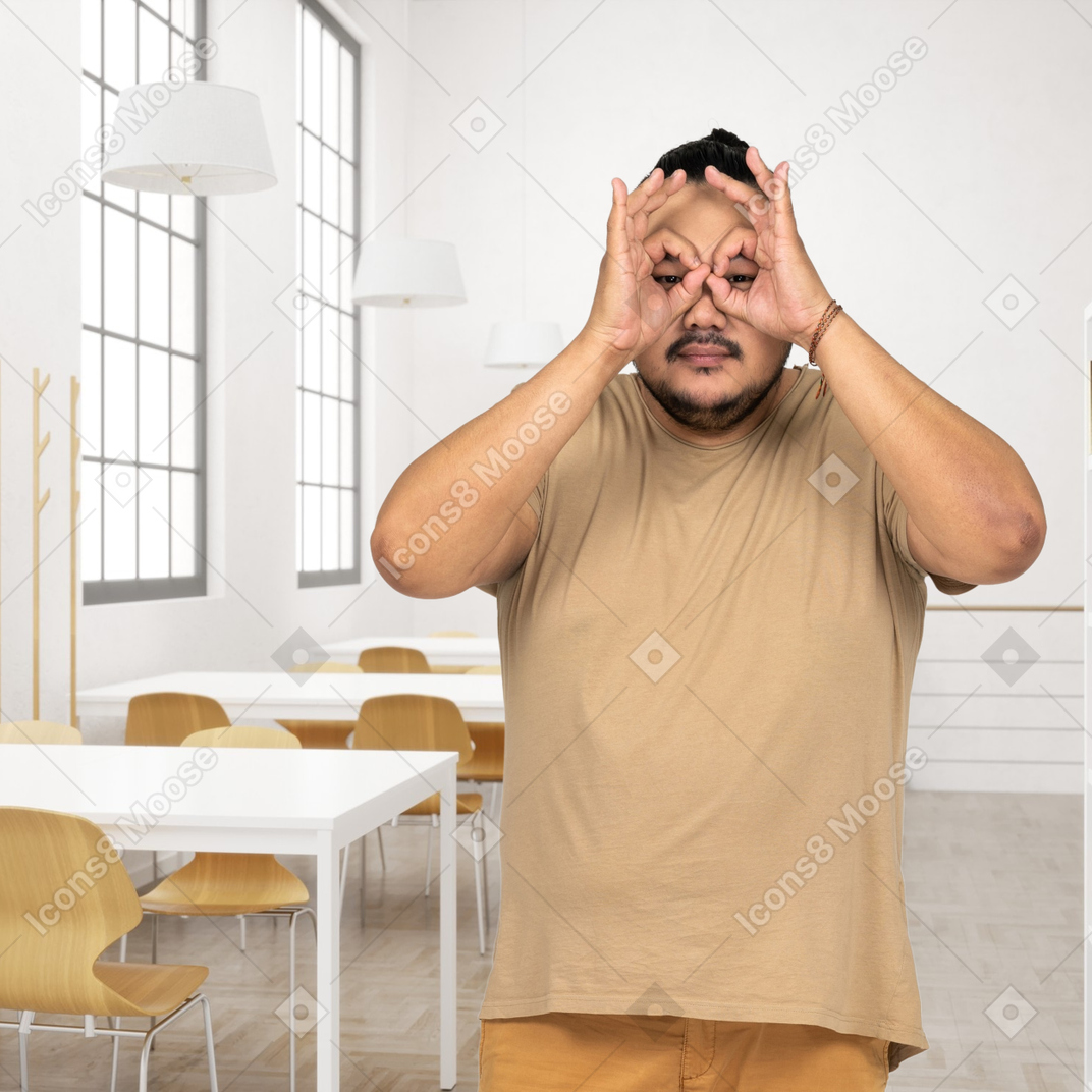 A man is covering his eyes with his hands
