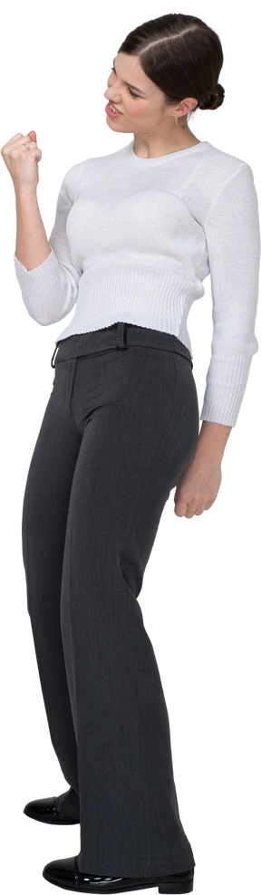Side view of a delighted young woman in office clothing