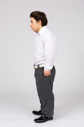 Side view of a male office worker looking aside