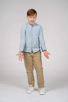 Front view of an emotional boy looking down