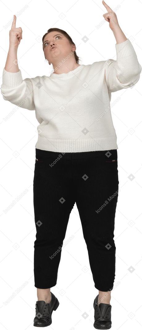 Front view of a plump woman in casual clothes pointing up