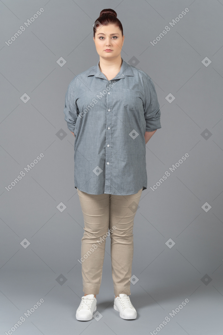Young woman posing on grey background