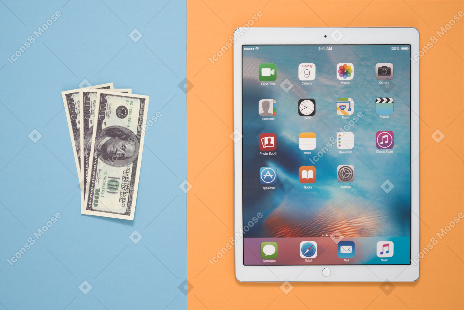Digital tablet and one hundred dollar bills